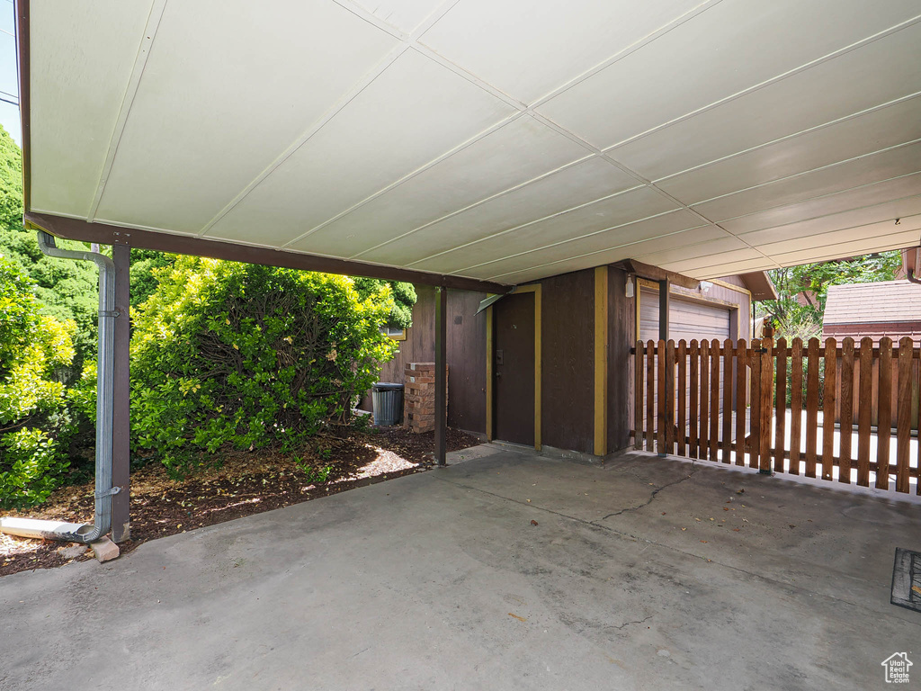 View of patio / terrace with an attached garage