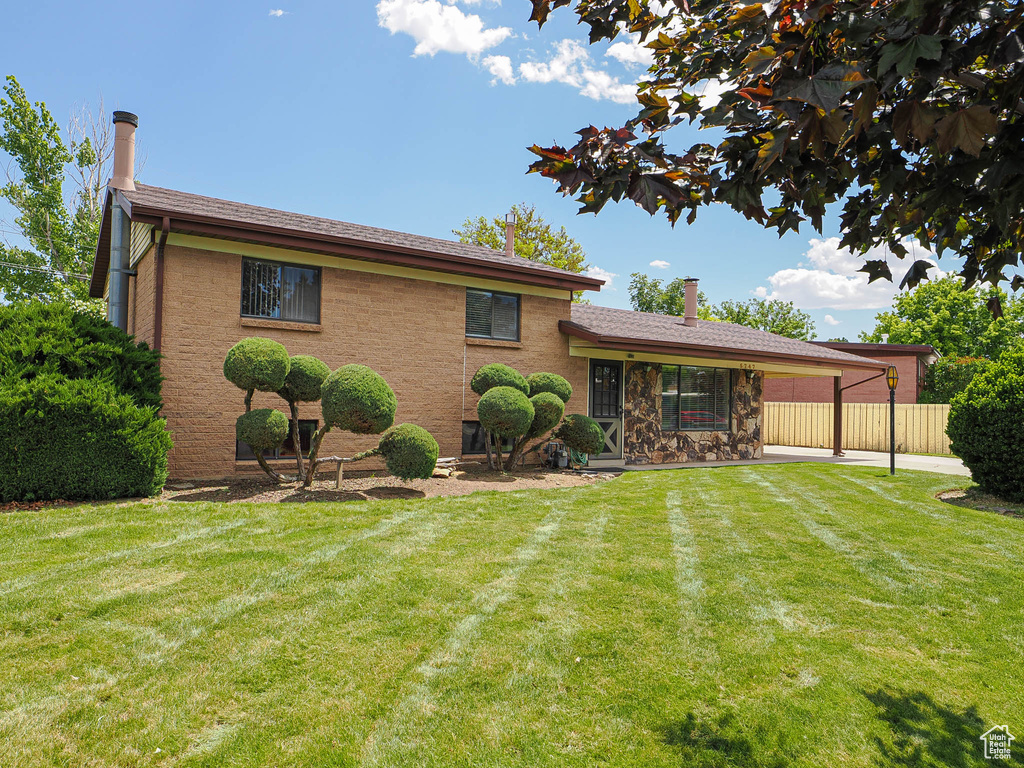 Back of house with a patio