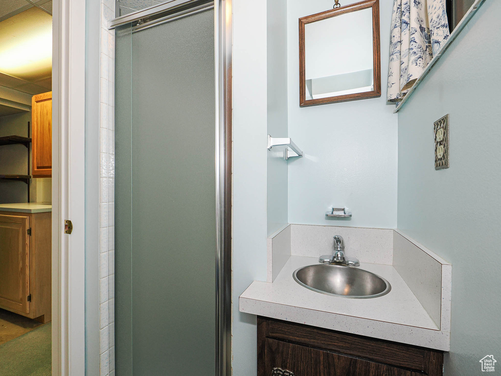 Full bathroom with a stall shower and vanity