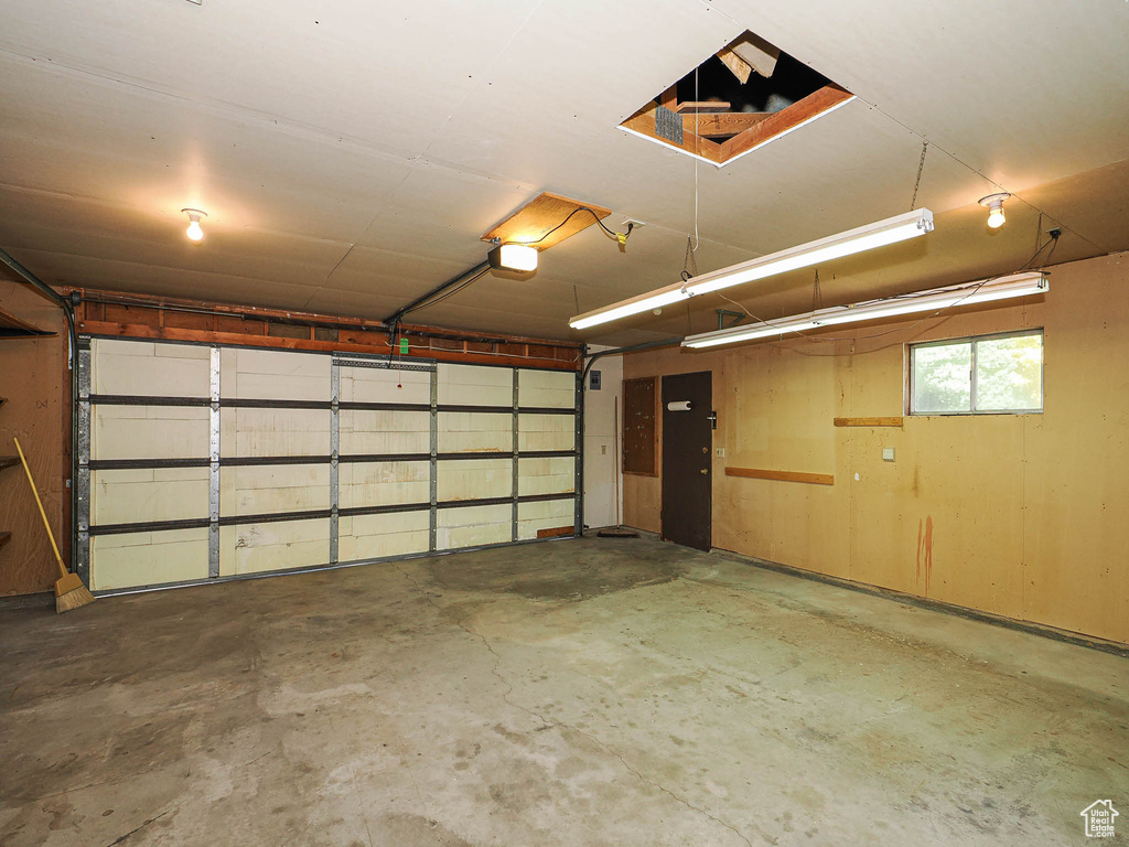 Garage featuring a garage door opener