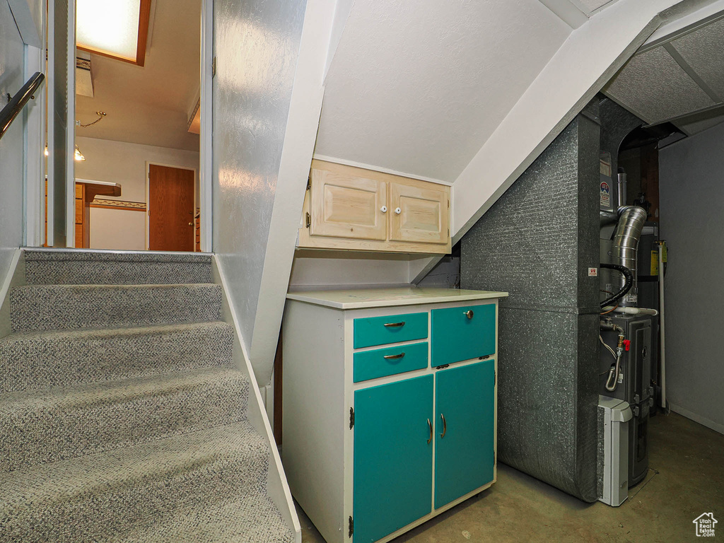 Stairway featuring concrete flooring
