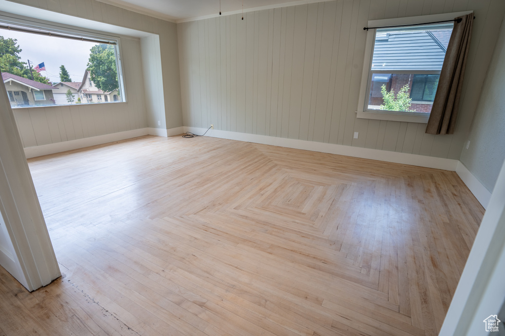 Unfurnished room with baseboards and ornamental molding