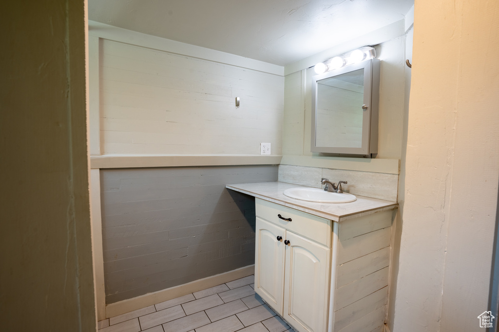 Bathroom with vanity and tile patterned flooring