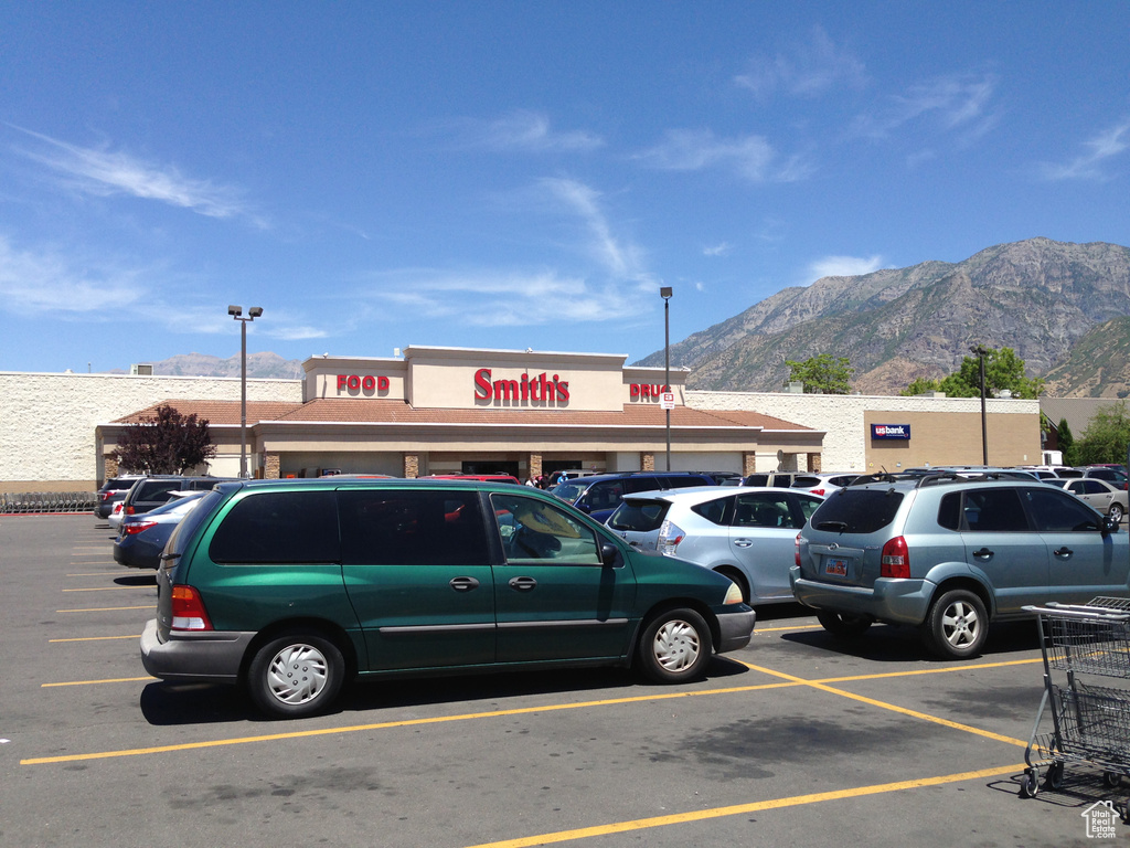 Uncovered parking lot featuring a mountain view