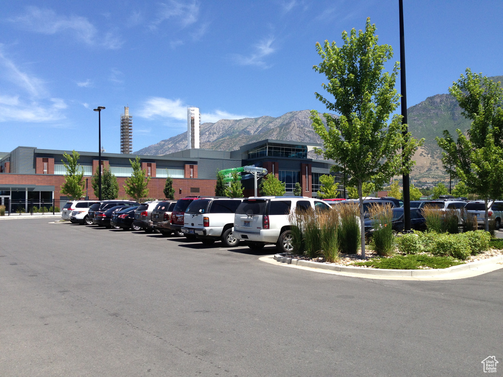 View of commercial property featuring a mountain view and uncovered parking