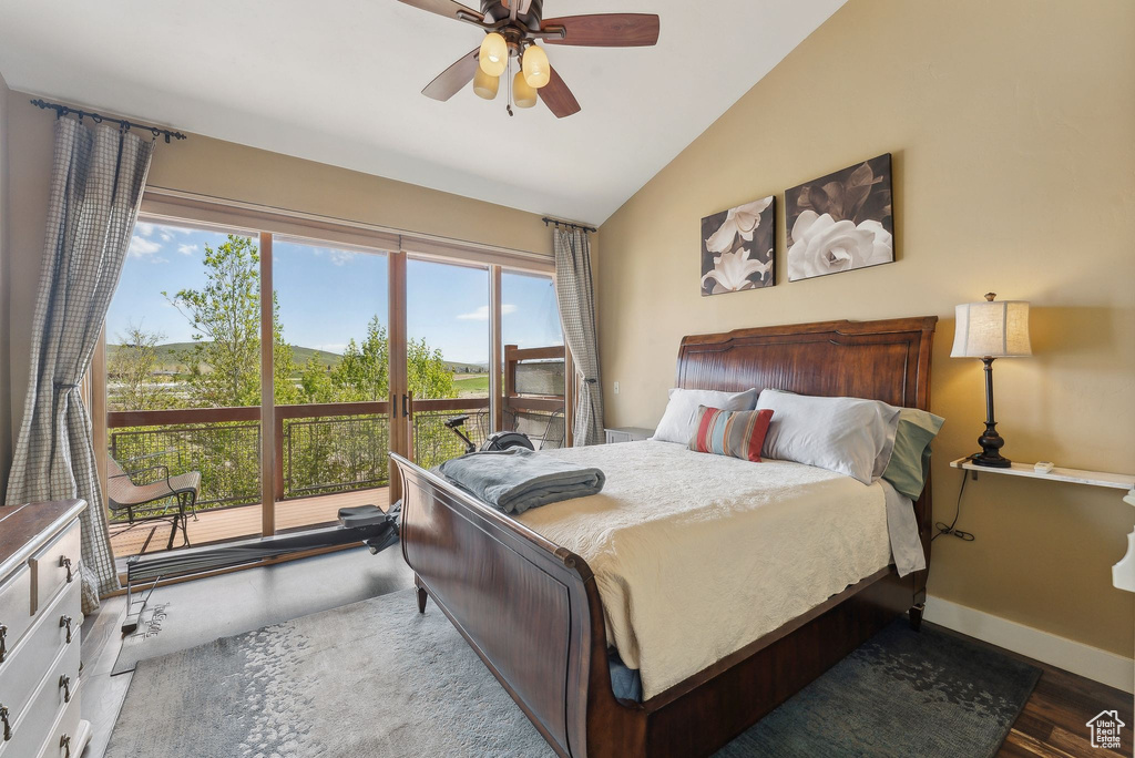 Bedroom with lofted ceiling, baseboards, ceiling fan, wood finished floors, and access to outside