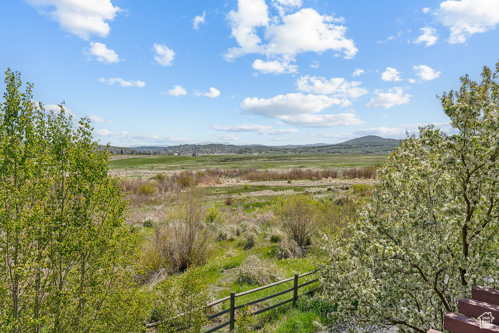 View of mountain backdrop with rural landscape
