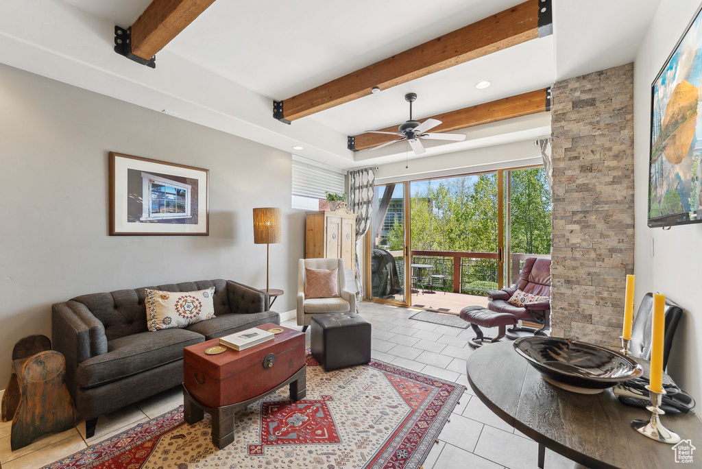 Tiled living room with beamed ceiling, a ceiling fan, and recessed lighting