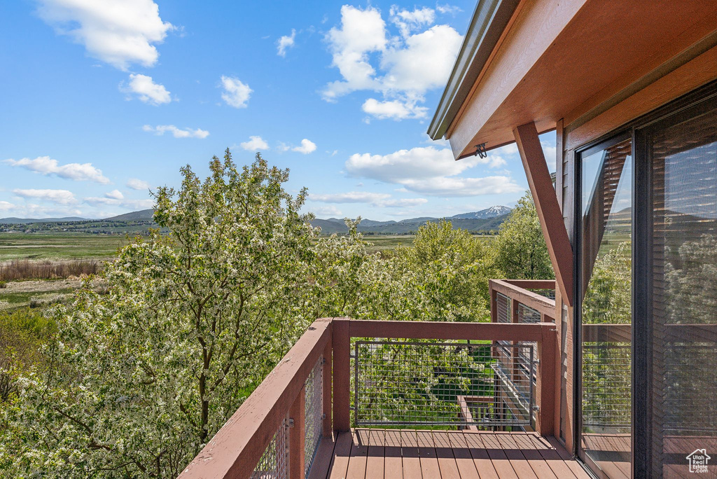 Wooden deck featuring a mountain view