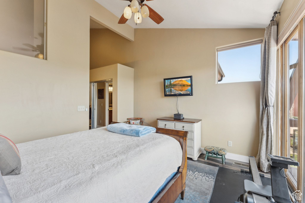 Bedroom featuring wood finished floors, a ceiling fan, and baseboards