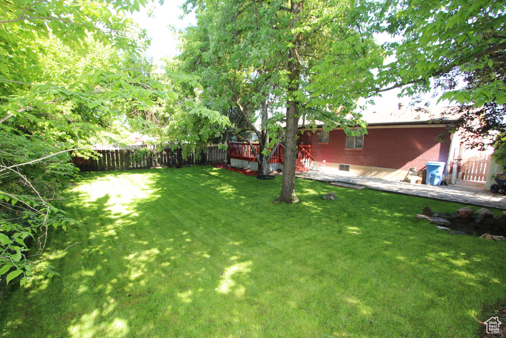 View of yard featuring a deck