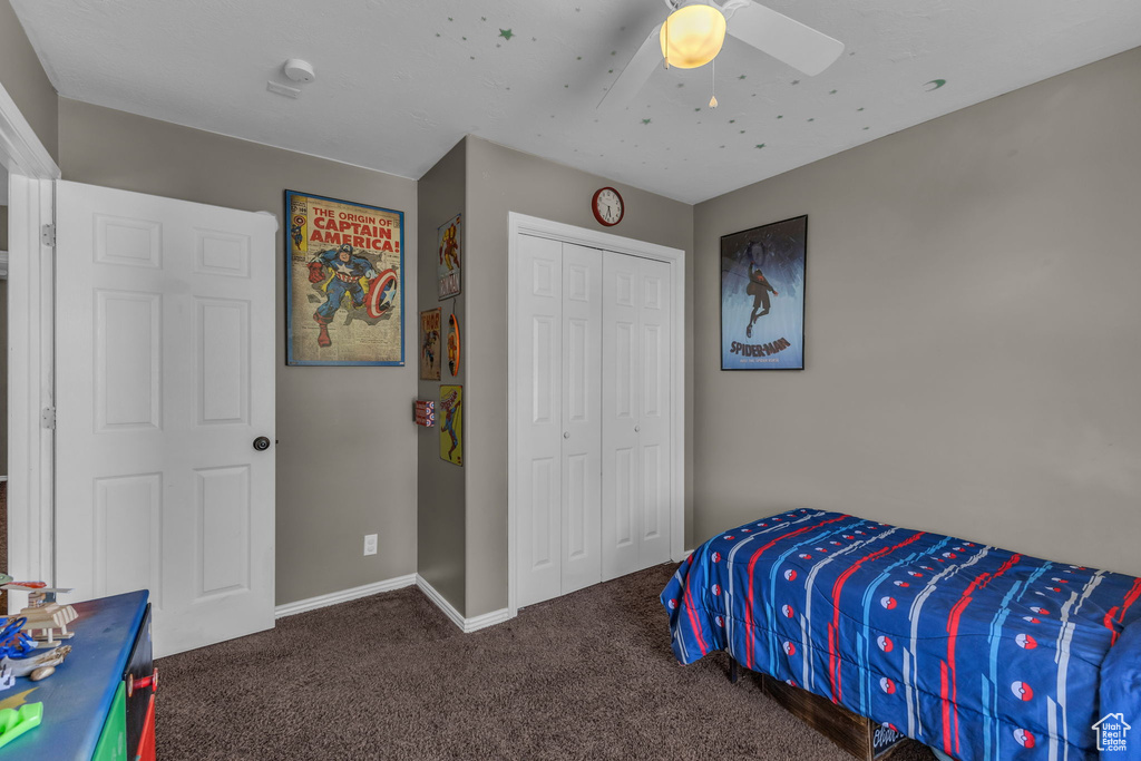 Bedroom featuring carpet, a closet, ceiling fan, and baseboards