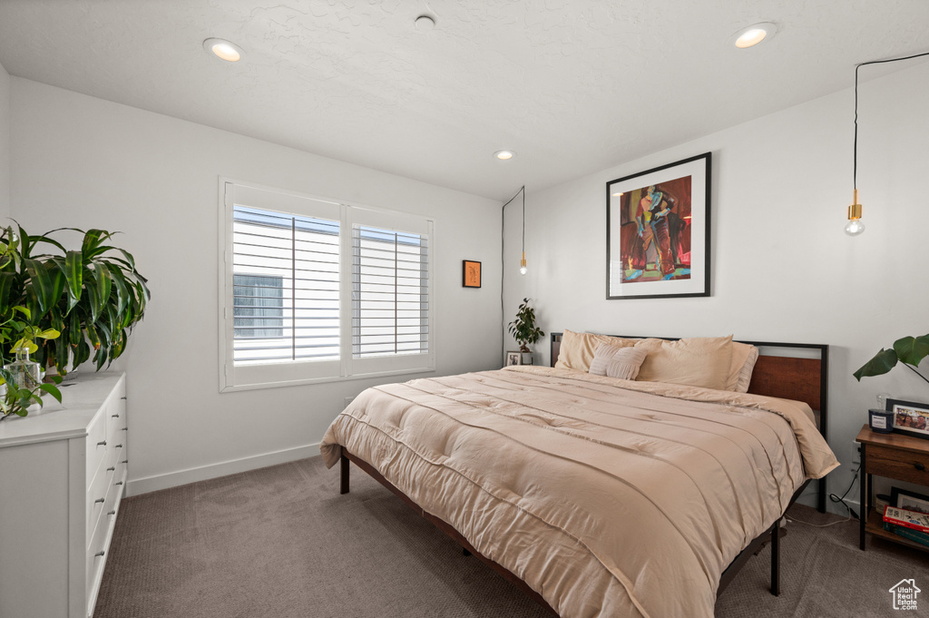 Carpeted bedroom featuring recessed lighting and baseboards