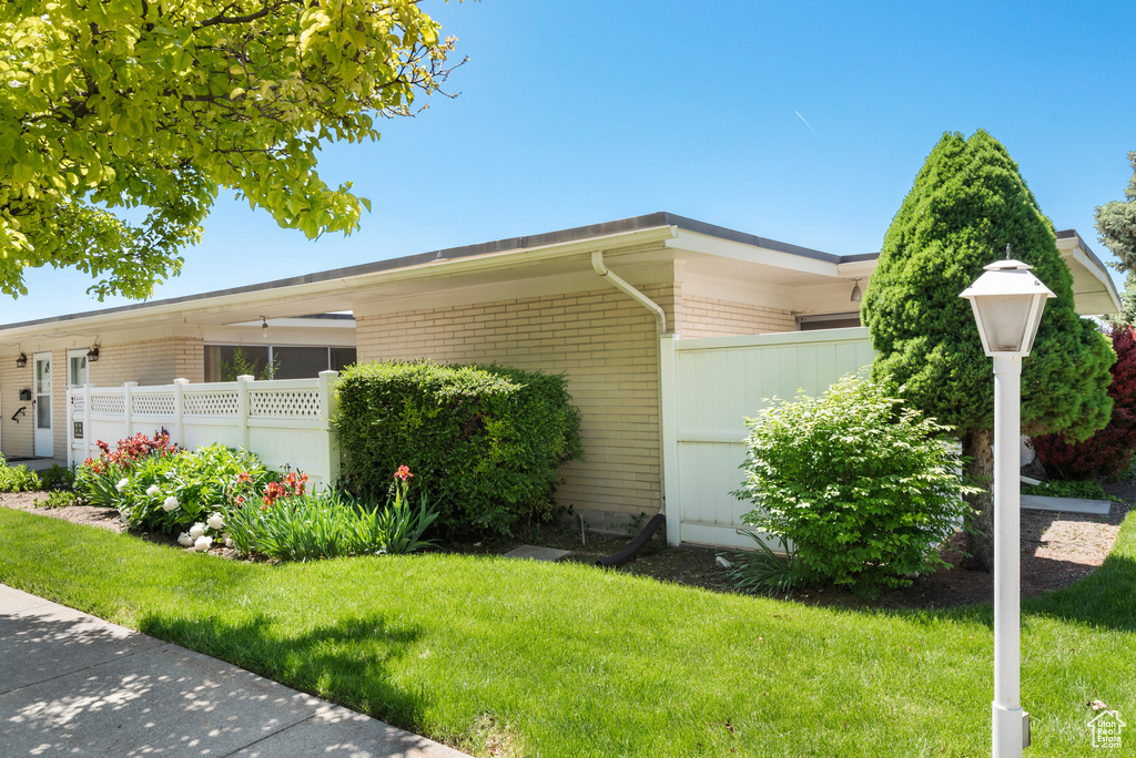 View of side of home with brick siding