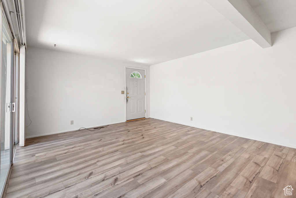 Unfurnished room with light wood-style floors