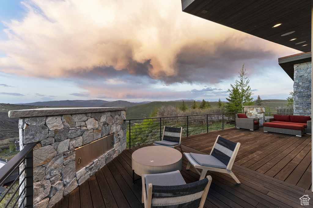 Deck at dusk with outdoor lounge area