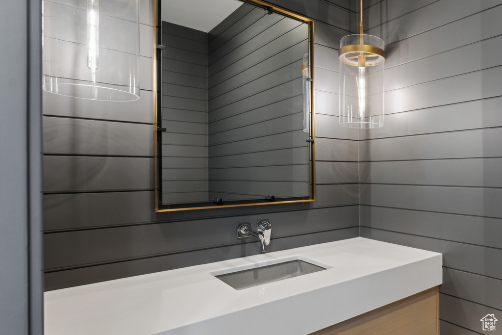 Bathroom featuring vanity and a shower
