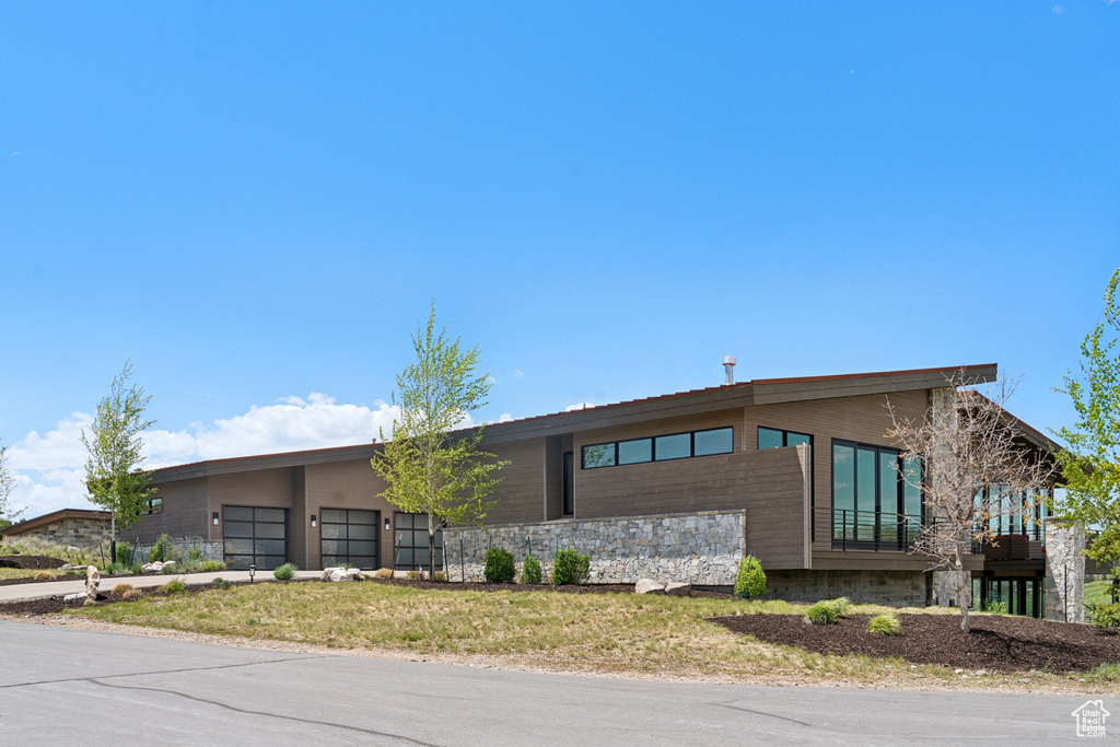 View of building exterior with a garage