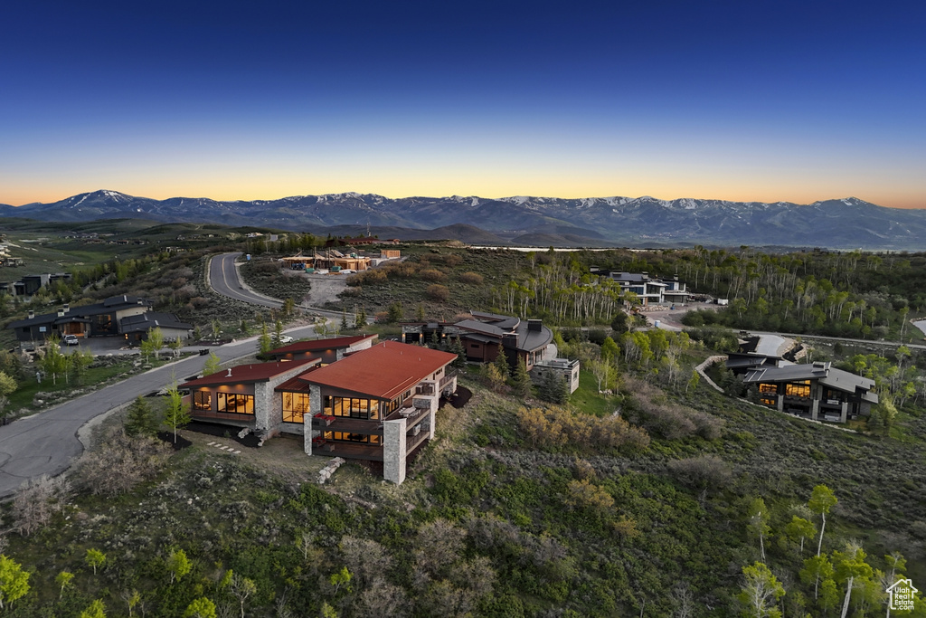 Aerial overview of property's location with a mountain backdrop
