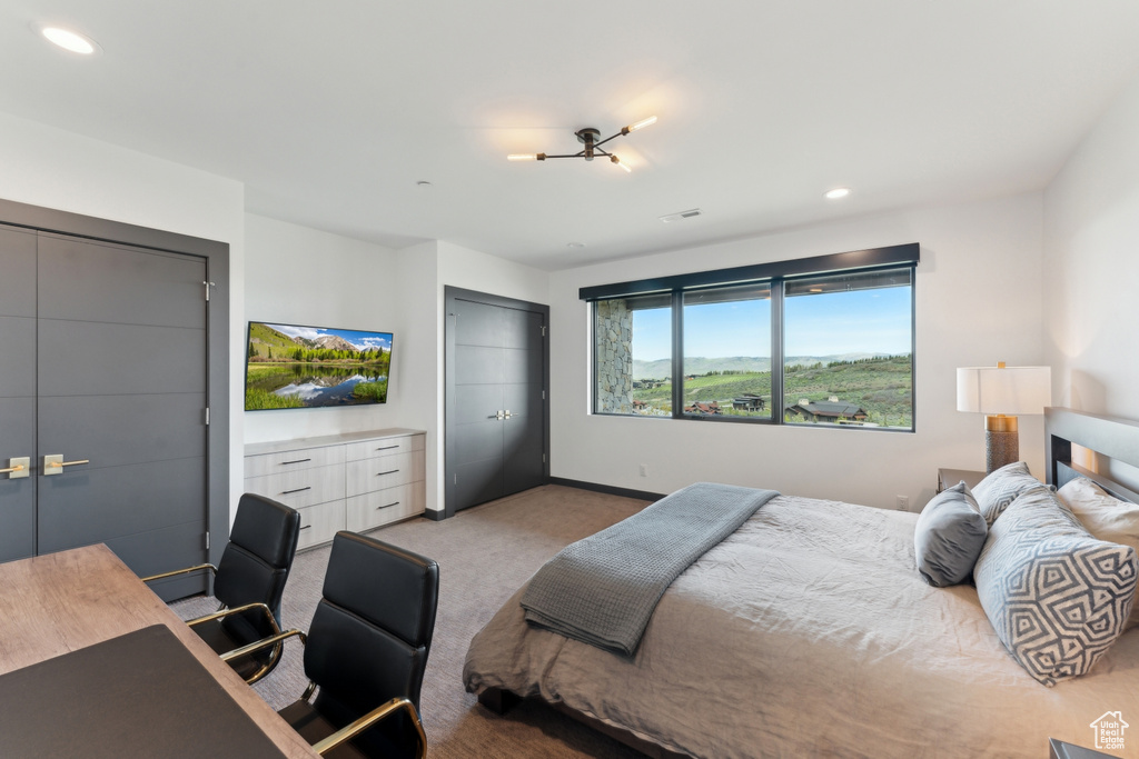 Carpeted bedroom featuring recessed lighting and baseboards