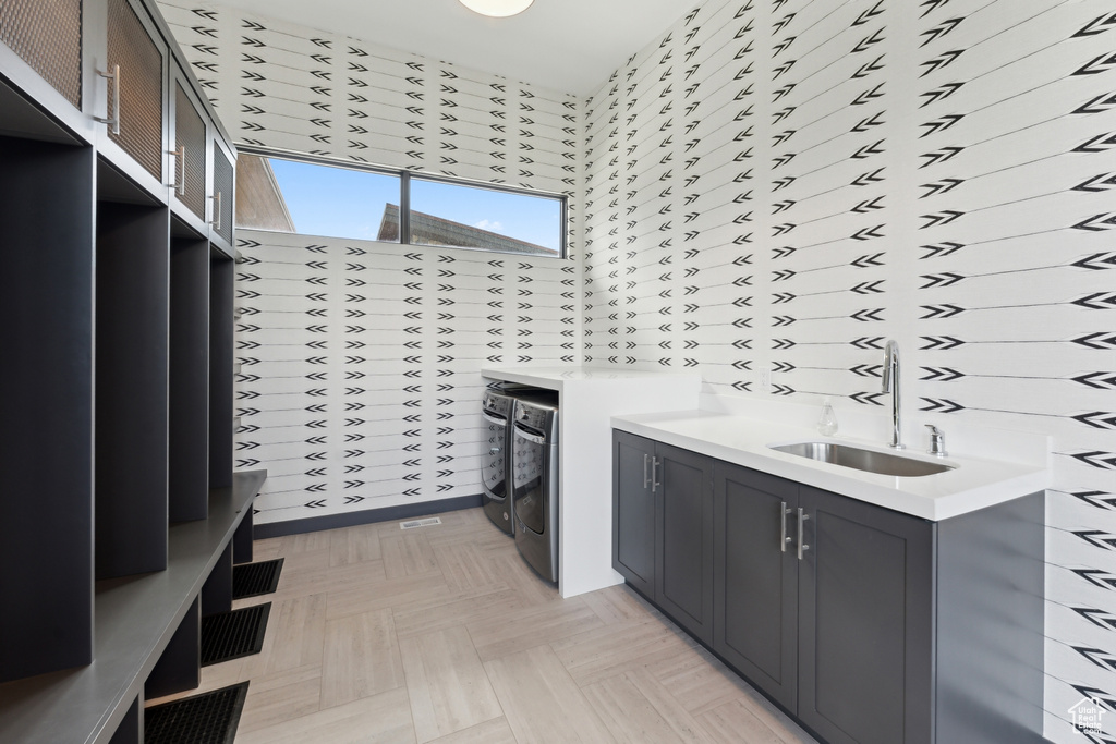Laundry room featuring cabinet space and washer and dryer