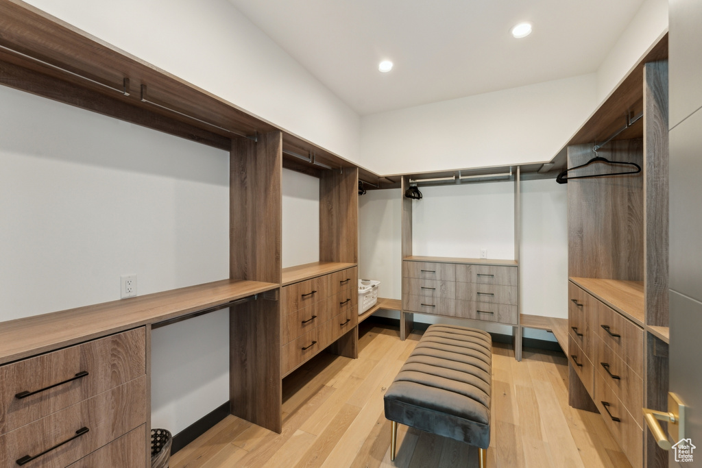 Walk in closet featuring light wood-style flooring