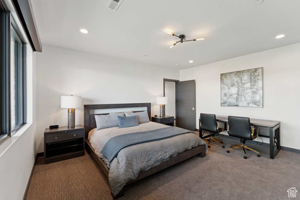 Carpeted bedroom with recessed lighting and baseboards