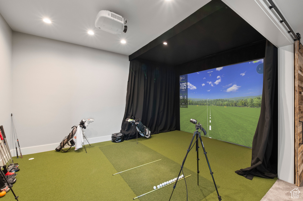 Recreation room with golf simulator, carpet flooring, baseboards, and recessed lighting