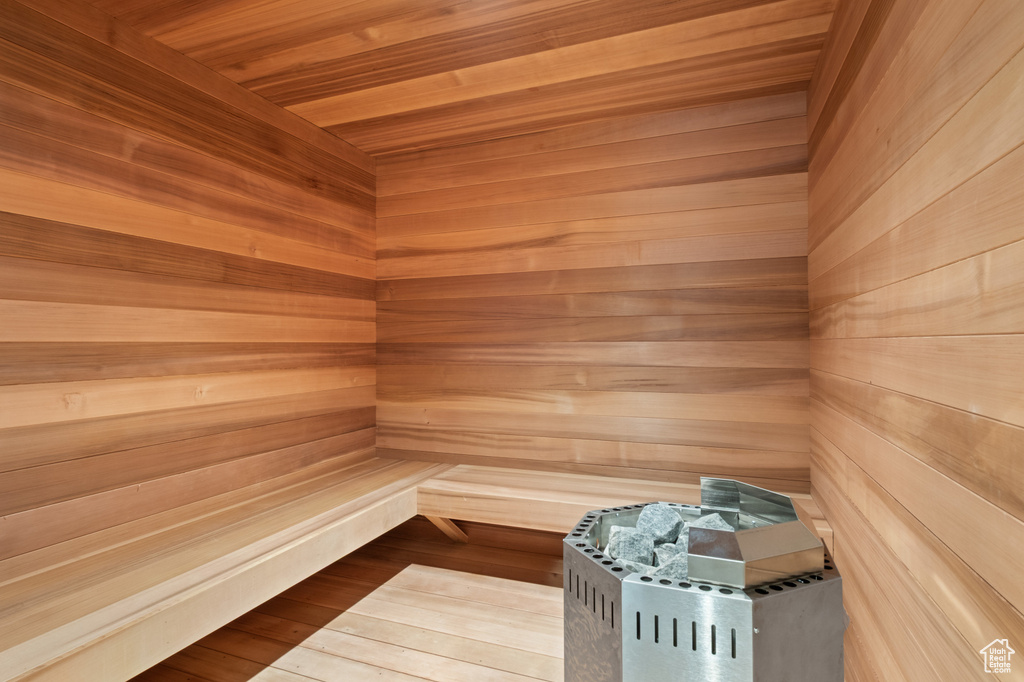 Relaxing sauna / steam room featuring wooden walls