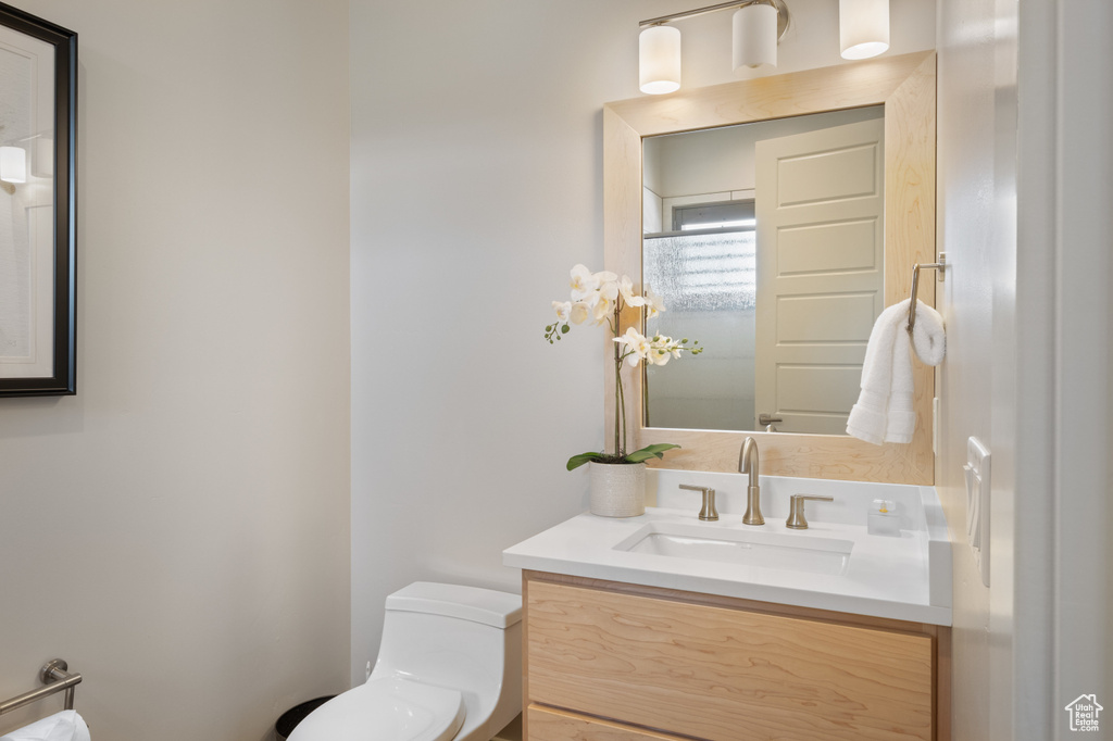 Bathroom with toilet and vanity