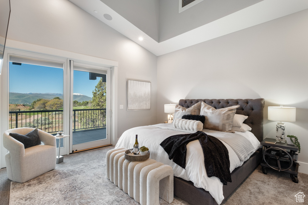 Bedroom with carpet floors, a high ceiling, access to exterior, a mountain view, and recessed lighting