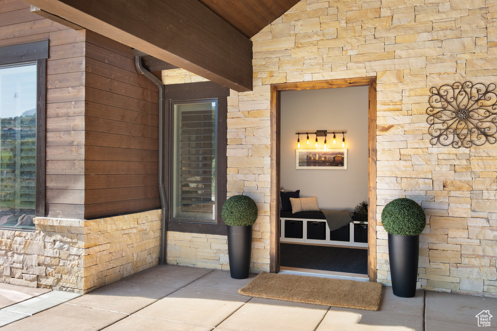 Property entrance with stone siding