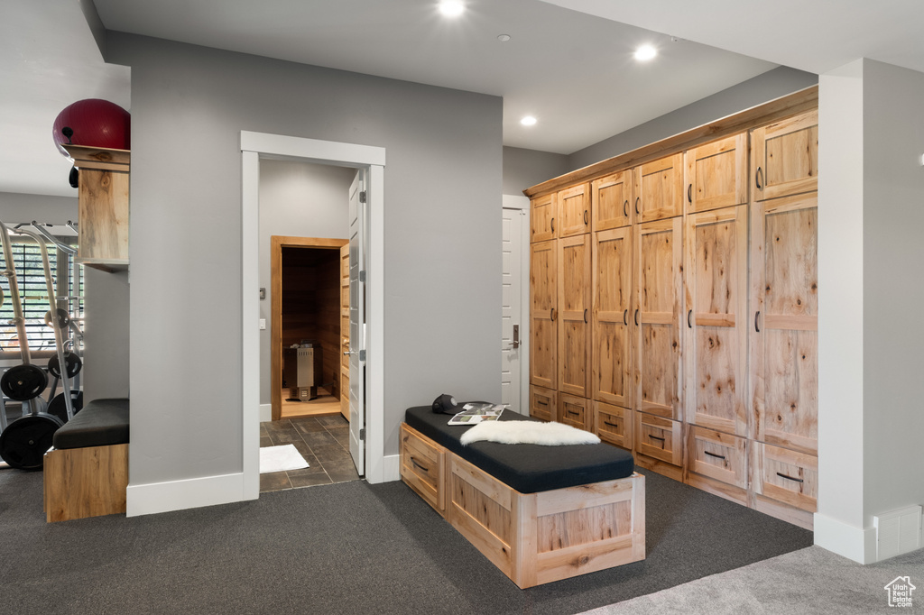 Mudroom with dark colored carpet, baseboards, and recessed lighting