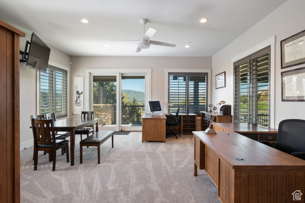 Office space with light colored carpet, ceiling fan, and recessed lighting