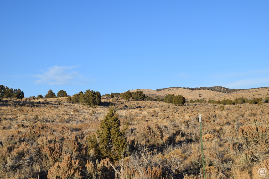 View of mountain background featuring rural landscape