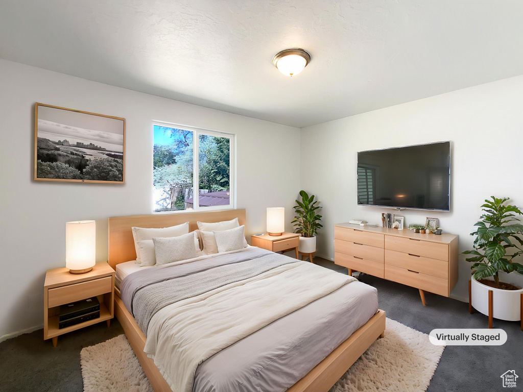 Bedroom with dark carpet
