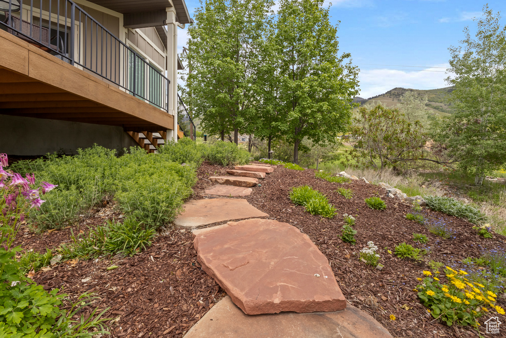 View of yard featuring a mountain view and stairs
