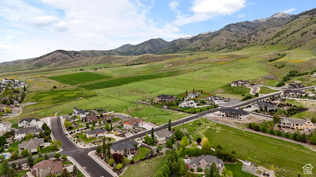 Aerial view of property\'s location with a mountainous background and nearby suburban area