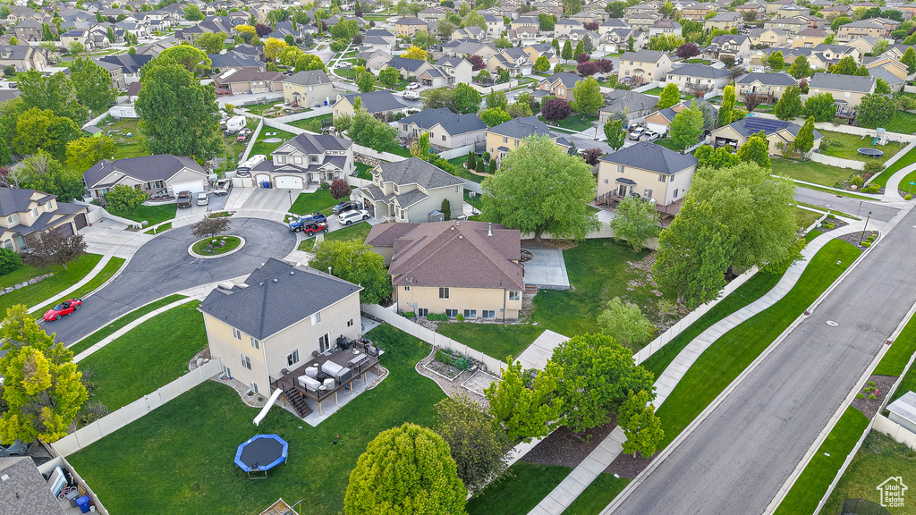 Aerial view of property and surrounding area featuring nearby suburban area
