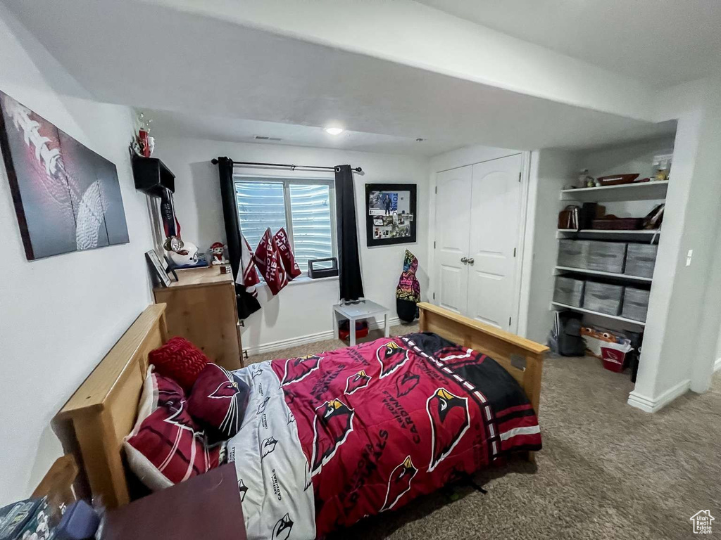 Bedroom with carpet flooring and a closet