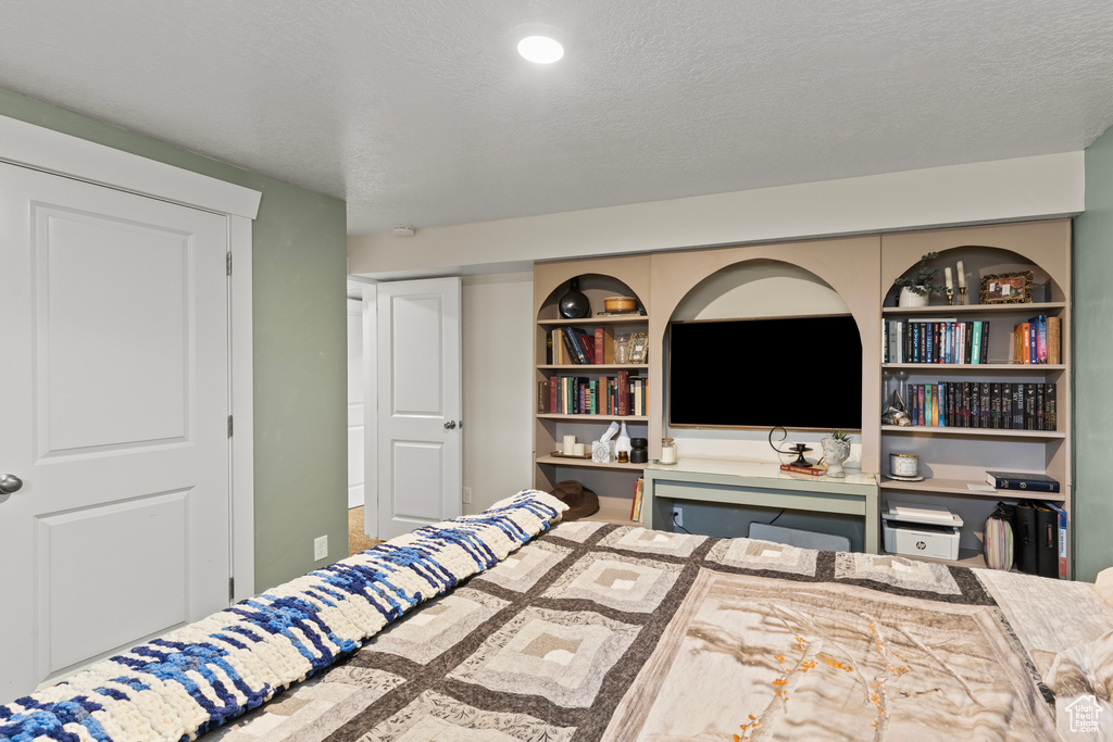 Bedroom featuring a textured ceiling