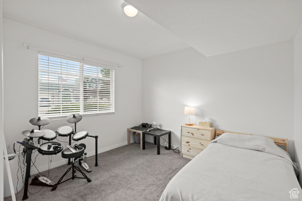 Bedroom with carpet floors and baseboards