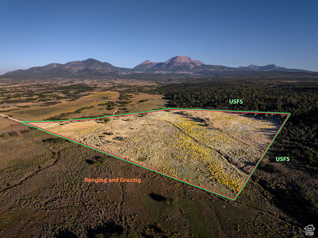 View of rural area with a mountain backdrop and property parcel outlined
