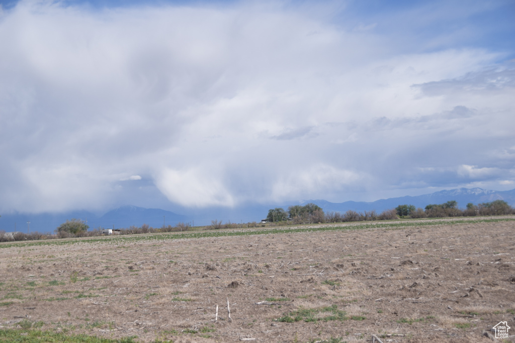 View of mountain background featuring rural landscape