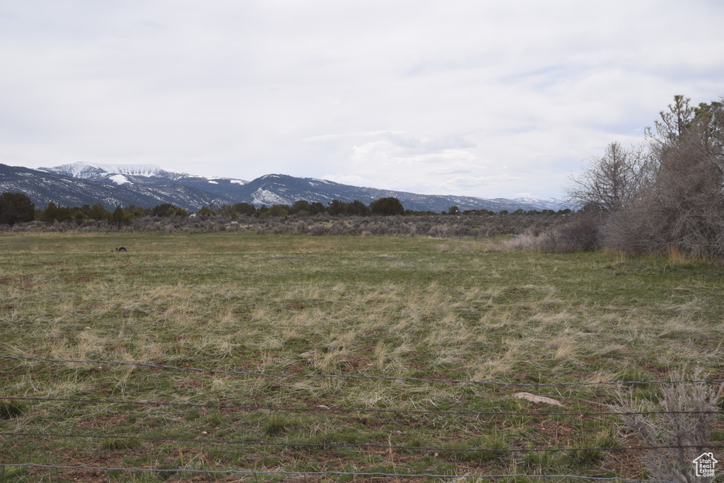 View of mountain backdrop with rural landscape
