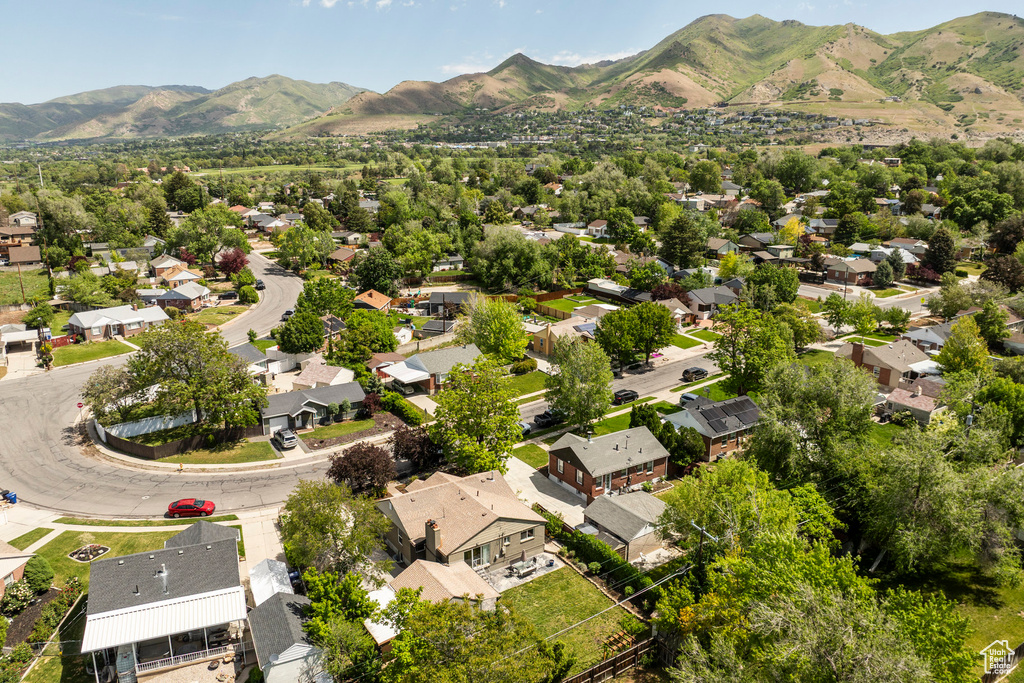 Aerial perspective of suburban area with a mountain backdrop