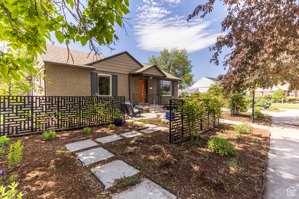View of front of house with brick siding