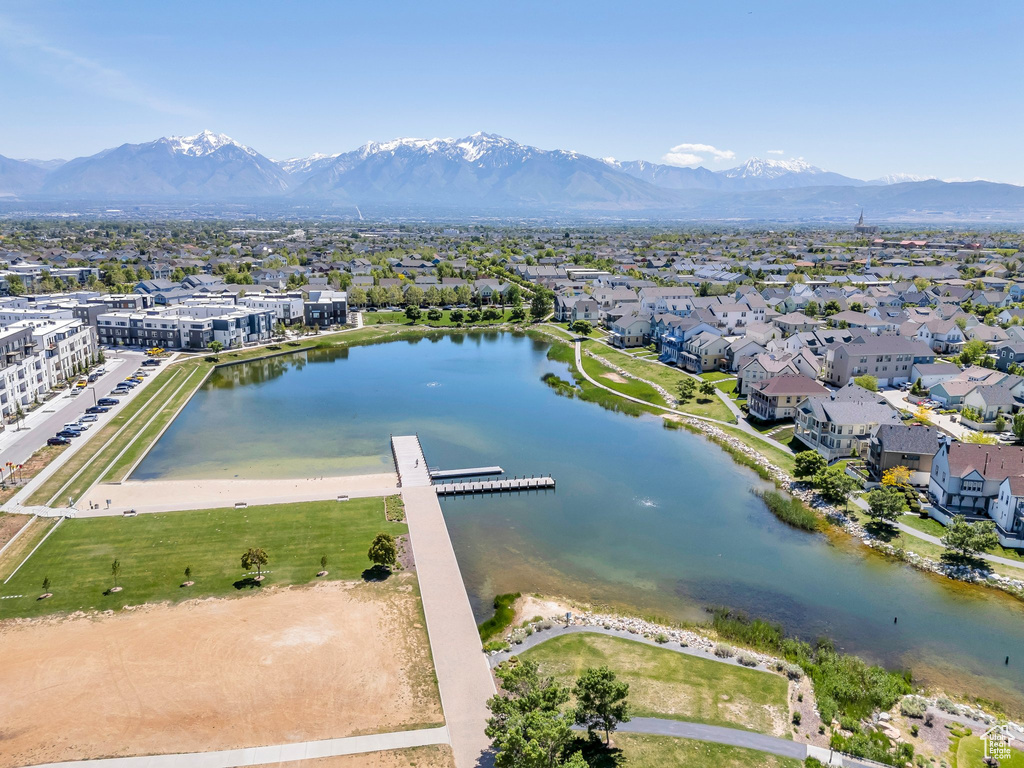 Aerial perspective of suburban area with a water and mountain view