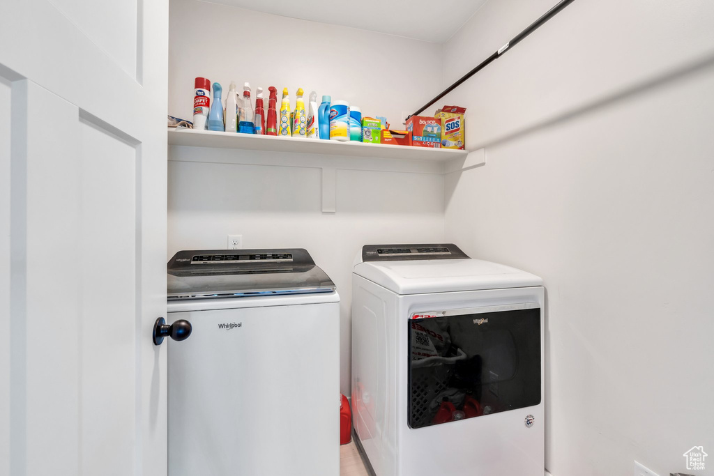 Washroom featuring independent washer and dryer