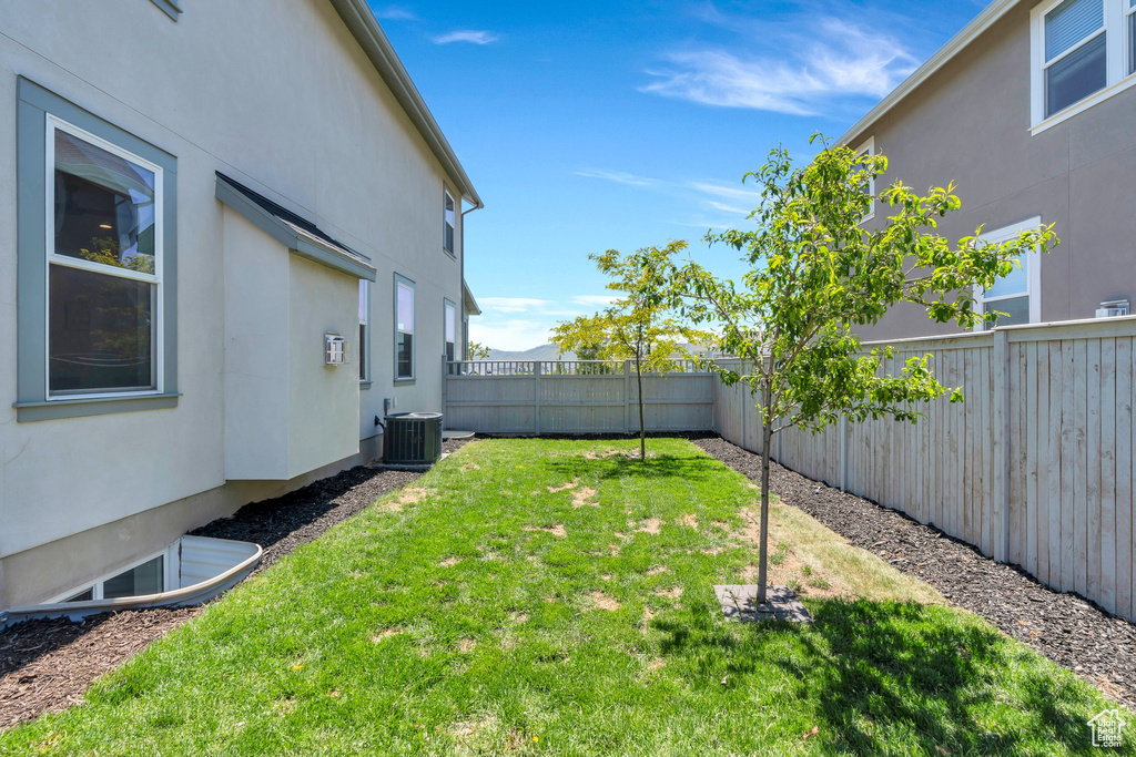 View of yard with central AC